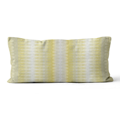 Striped pillow with yellow and gray pattern on a white background