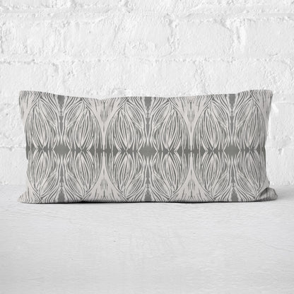Rectangular lumbar pillow featuring an abstract linocut pattern in grey tones.