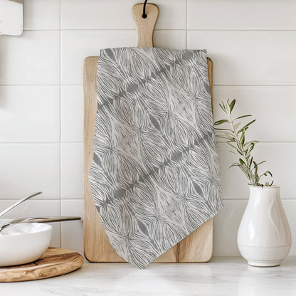 Flour sack tea towel featuring a gray and beige abstract pattern