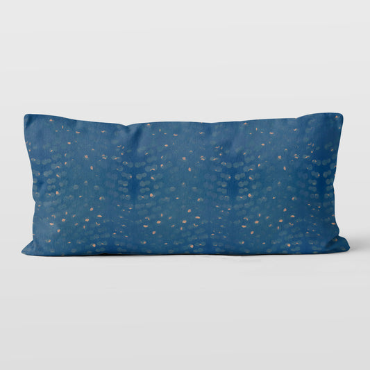 Rectangular lumbar pillow with hand-painted blue and beige pattern.