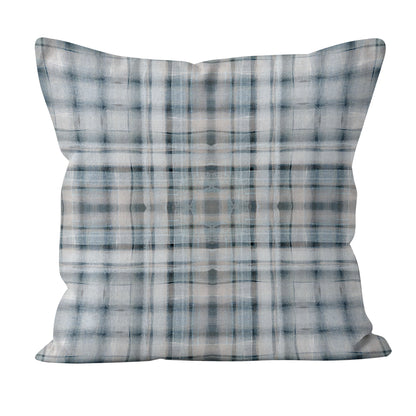 Plaid patterned pillow on a white background