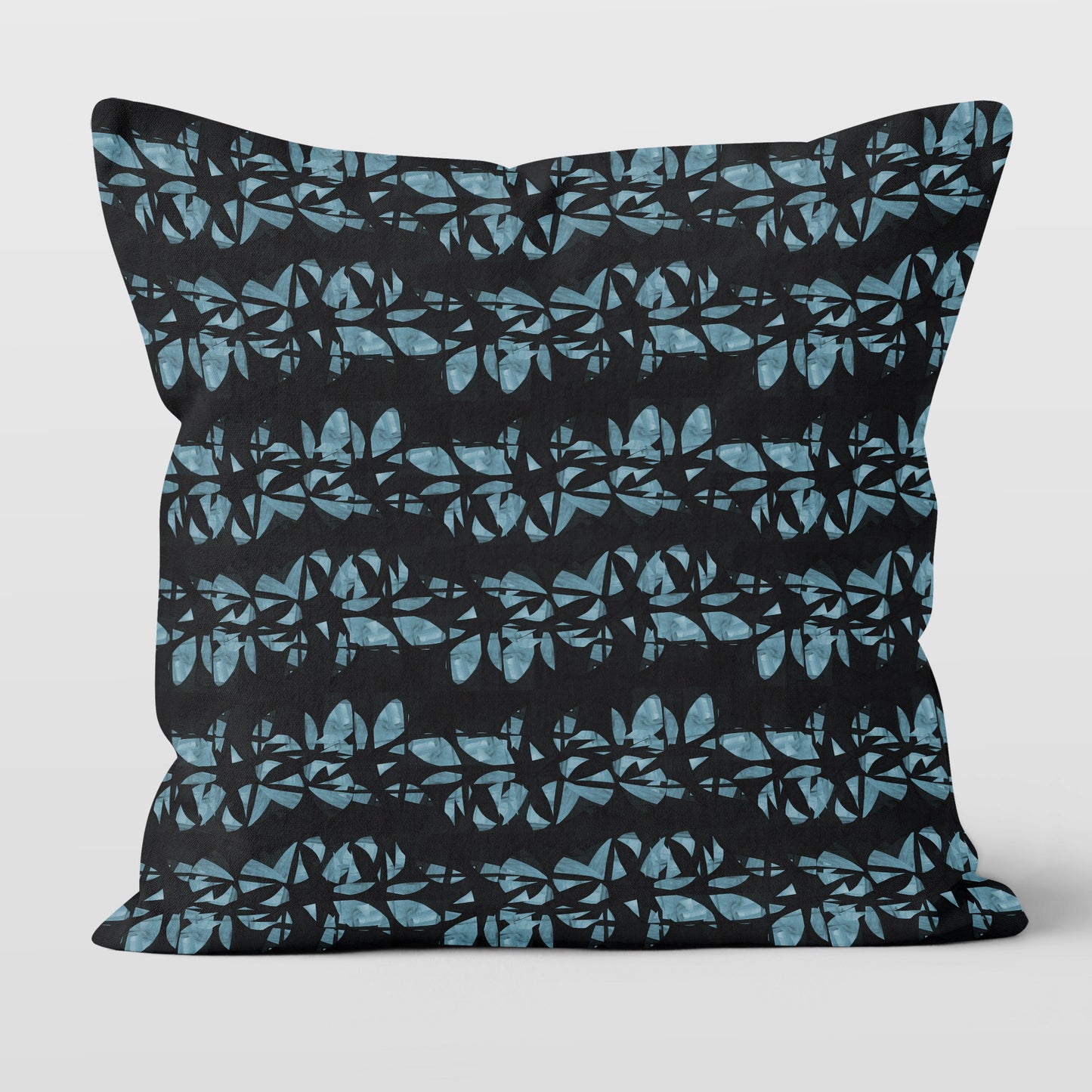 Square throw pillow featuring hand painted, abstract floral lei pattern in aqua blue and black.