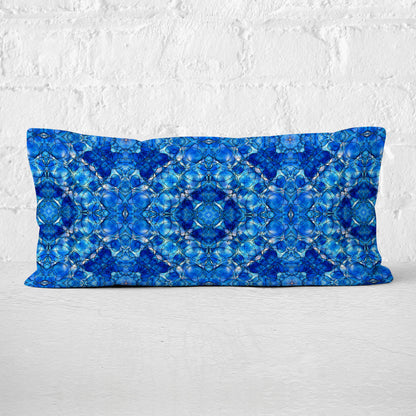 Rectangular lumbar pillow featuring a hand painted abstract pattern in cobalt blue.