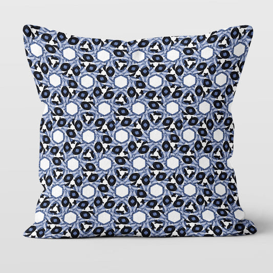 Throw pillow featuring abstract geometric blue and white pattern.