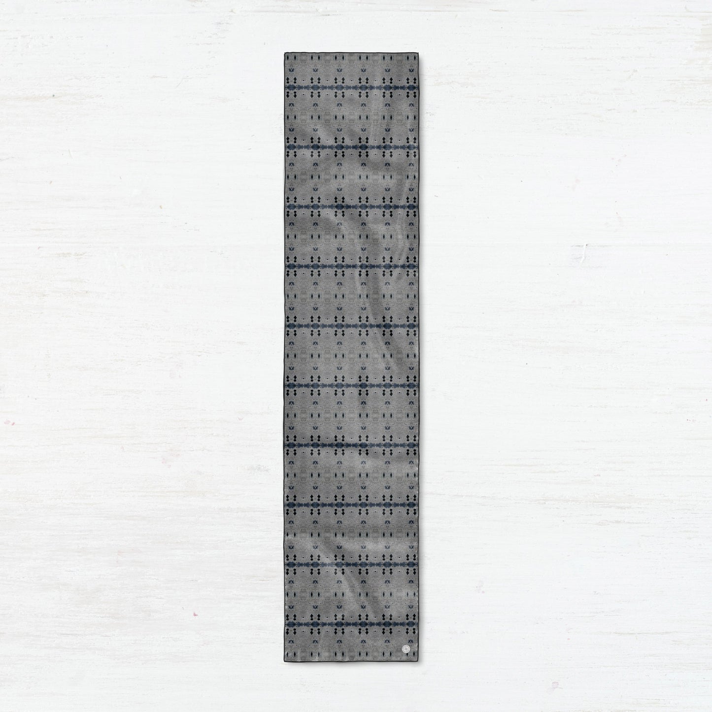 Rectangular silk scarf featuring a gray abstract pattern