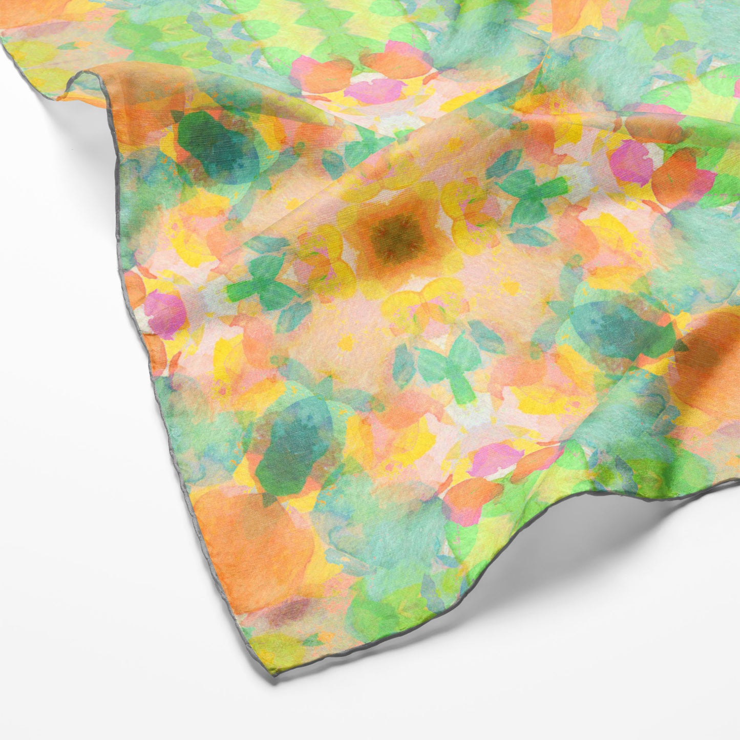 Silk scarf featuring an abstract peach and green hand-painted pattern