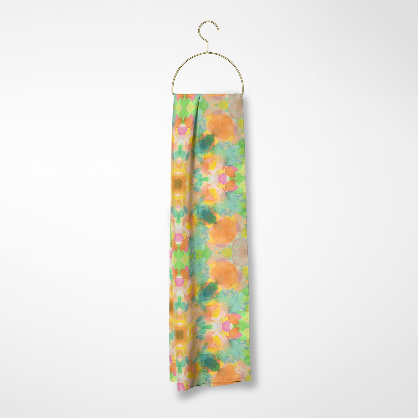 Silk scarf featuring an abstract peach and green hand-painted pattern