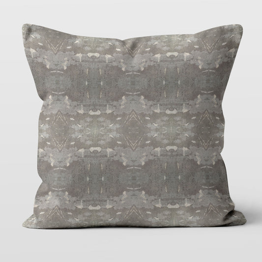 Square throw pillow featuring an abstract gray and khaki pattern
