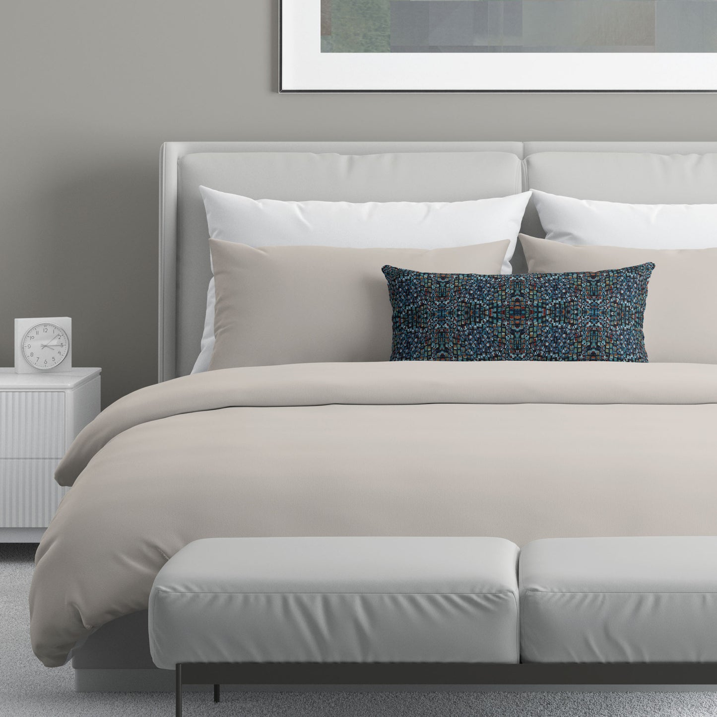 Neutral bedroom scene featuring a blue abstract pattern lumbar pillow