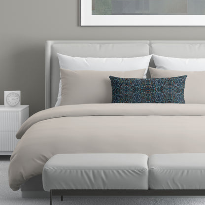 Neutral bedroom scene featuring a blue abstract pattern lumbar pillow