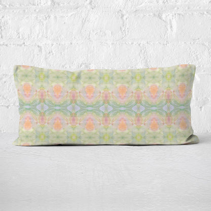 Detail of lumbar pillow featuring a hand-painted abstract pattern in pastel colors.