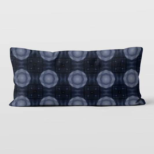 12  inch by 24 inch lumbar pillow featuring a collage-based geometric pattern in shades of blue.