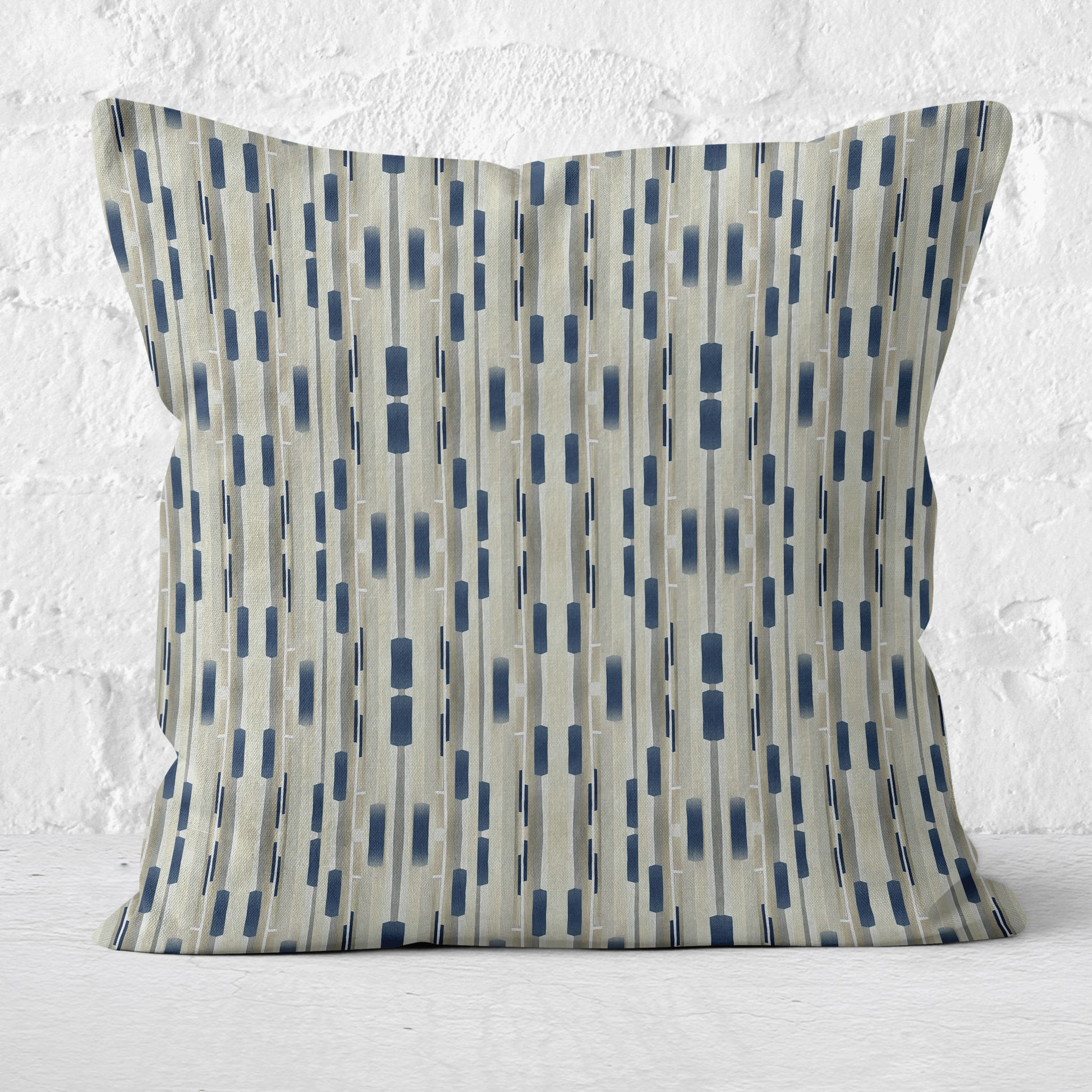 Square throw pillow featuring a tan and navy blue abstract stripe pattern