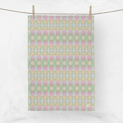 Abstract pink floral tea towel hanging from a clothesline