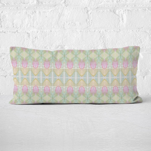 rectangular pillow featuring a hand-painted abstract rosebud pattern.