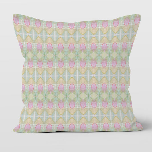 Square throw pillow featuring a pastel rosebud pattern in pink, green, blue, and peach