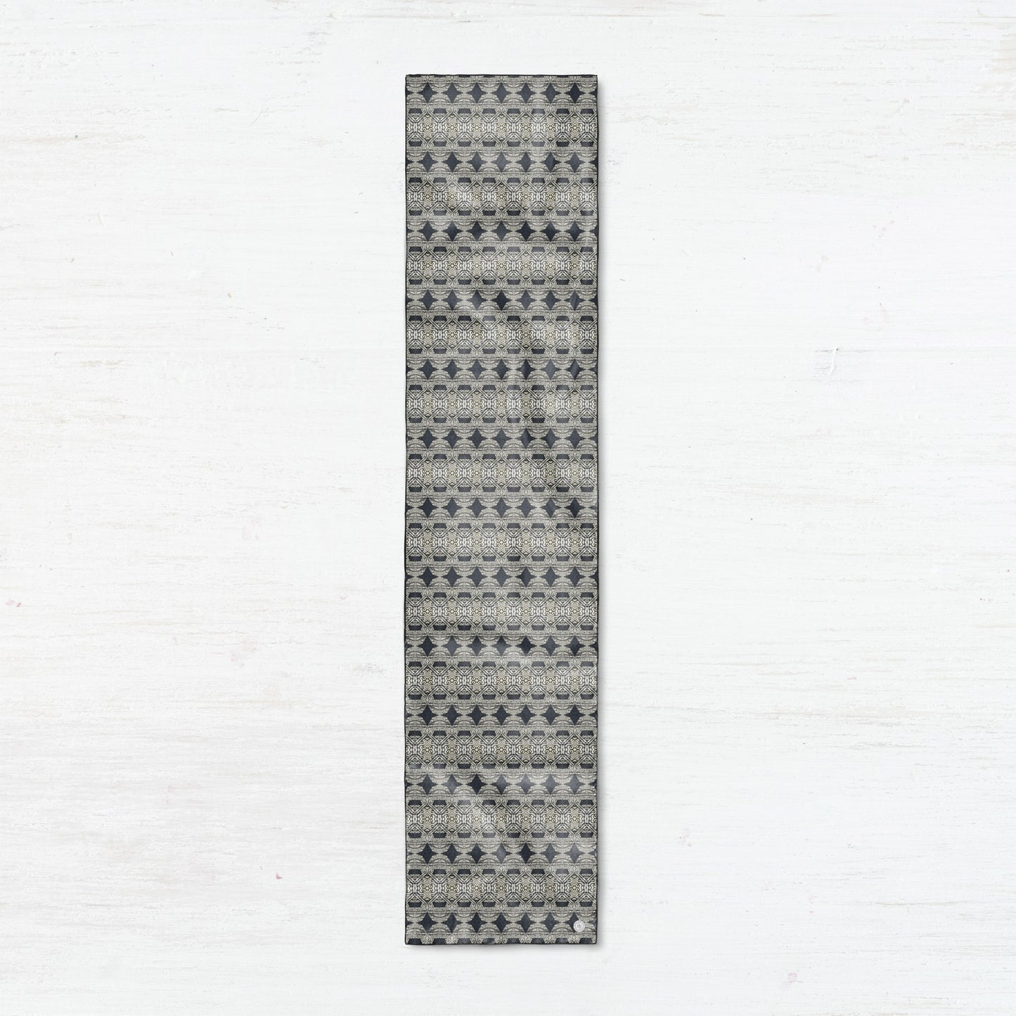 Oblong silk scarf featuring a charcoal gray abstract pattern,