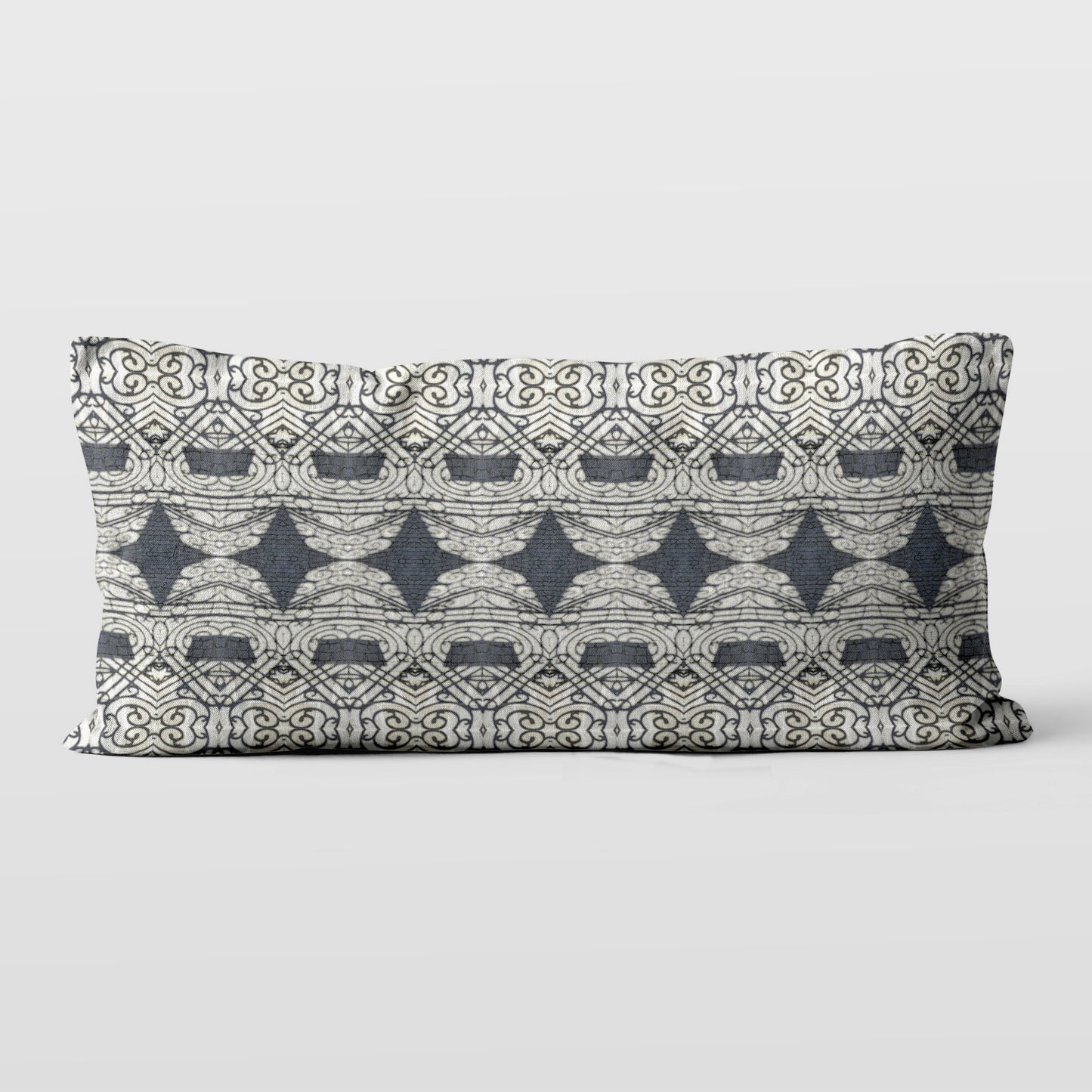 Rectangular lumbar pillow featuring abstract ornate pattern in black and grey tones.