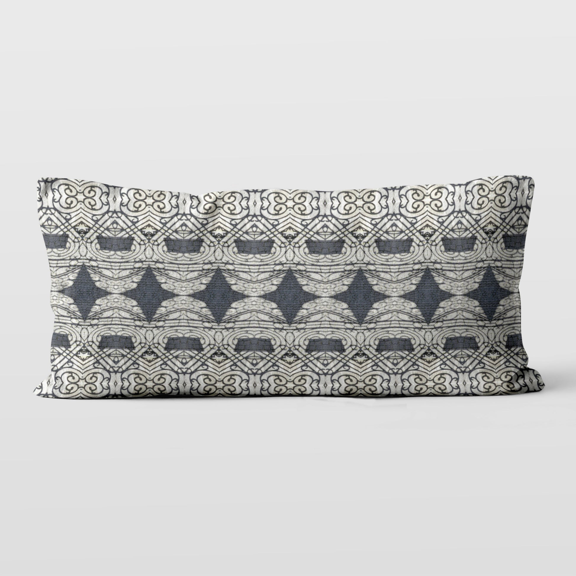 Rectangular lumbar pillow featuring abstract ornate pattern in black and grey tones.