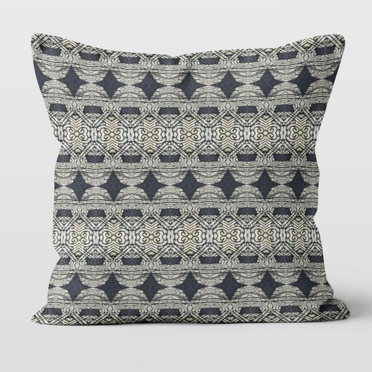Square throw pillow featuring an abstract and ornate pattern in black and grey tones.