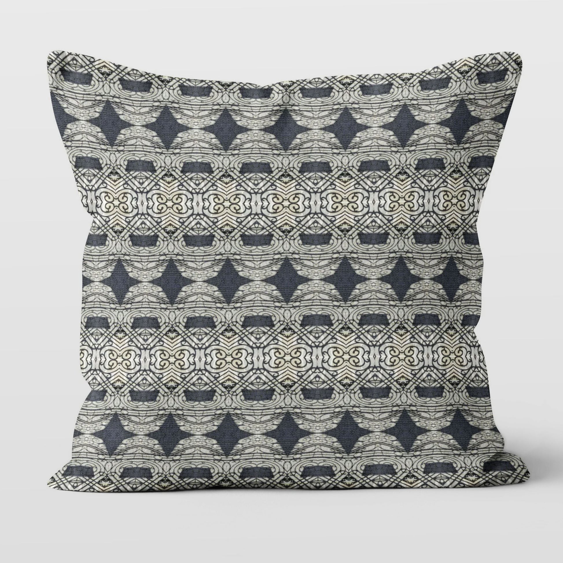 Square throw pillow featuring an abstract and ornate pattern in black and grey tones.