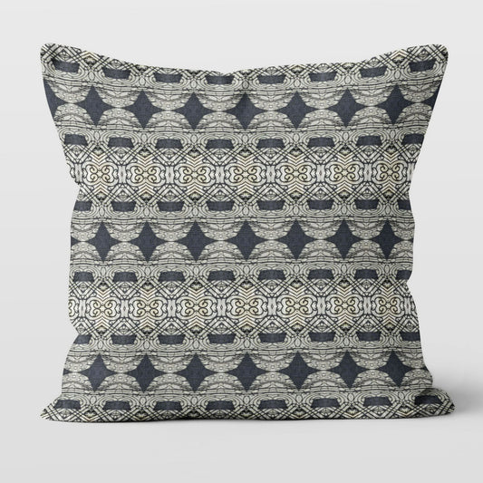 Square throw pillow featuring an abstract and ornate pattern in black and grey tones.
