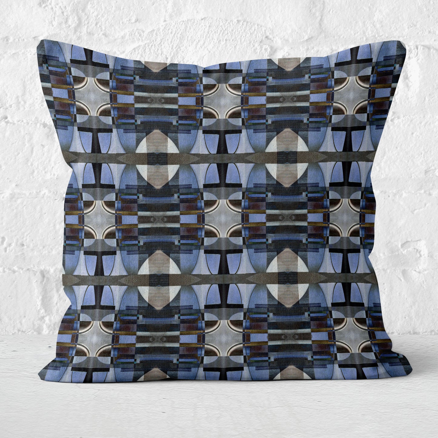 Decorative pillow with geometric pattern on a textured white background