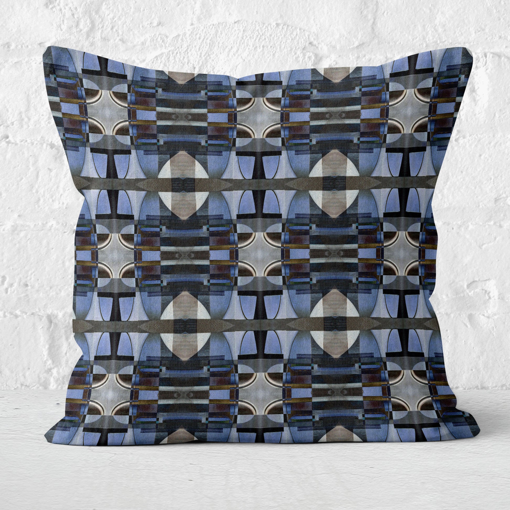 Decorative pillow with geometric pattern on a textured white background