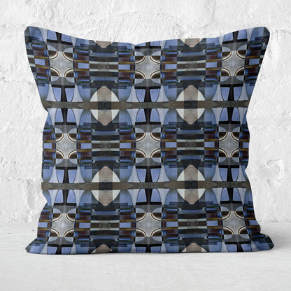 Decorative pillow with geometric pattern on a textured white background