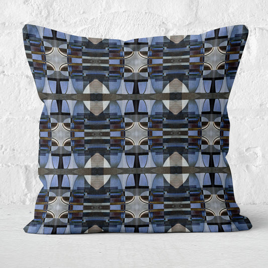 Decorative pillow with geometric pattern on a textured white background