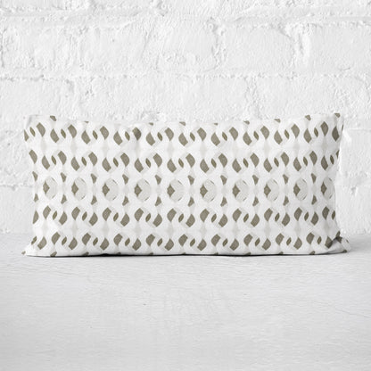 Rectangular lumbar pillow featuring an abstract hand-painted pattern in warm white, grey, and beige tones.