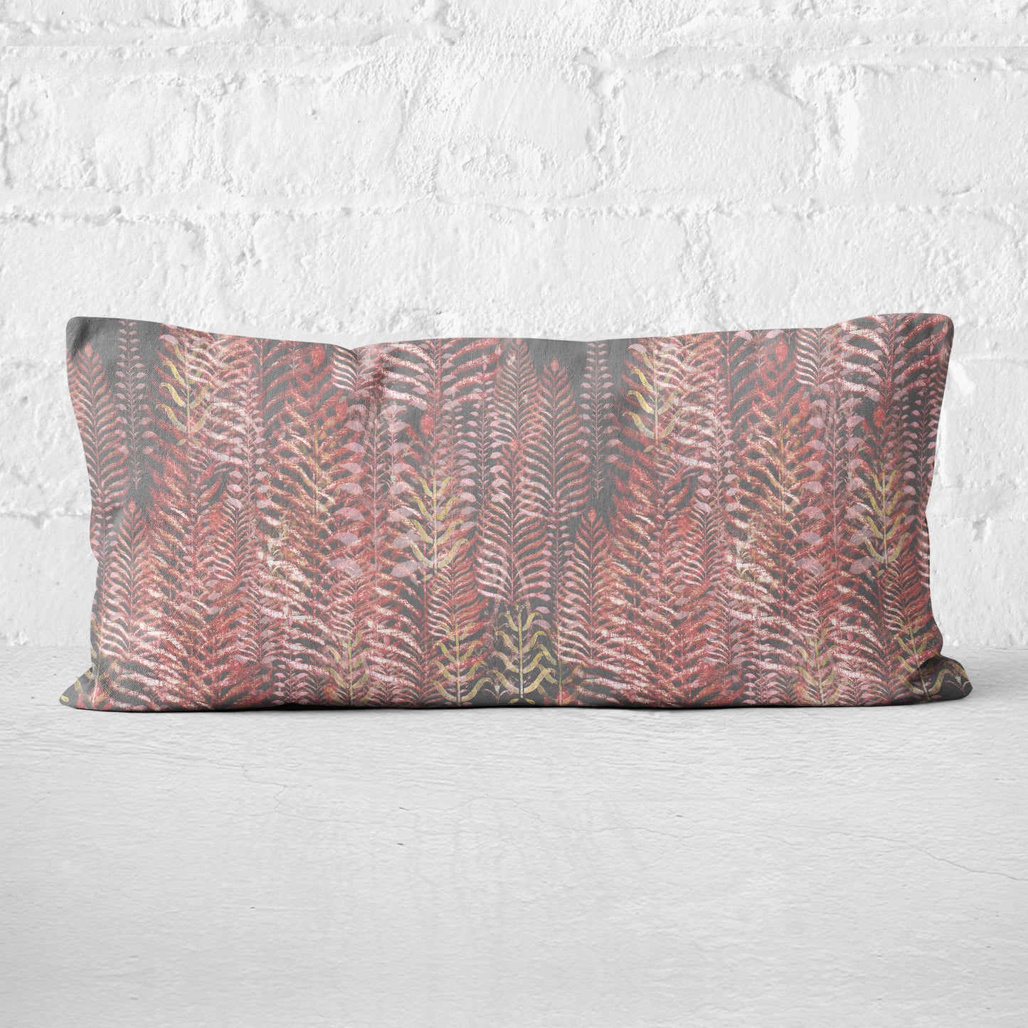 12 x 24 inch lumbar pillow featuring feather block print in pink and gray tones.