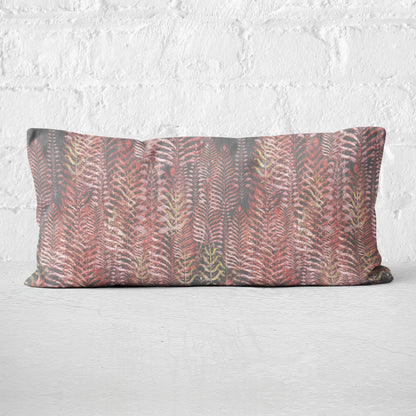 12 x 24 inch lumbar pillow featuring feather block print in pink and gray tones.