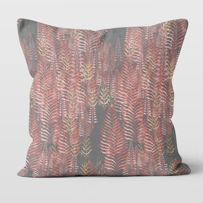 Square throw pillow featuring a block print tree pattern in pink and gray tones.