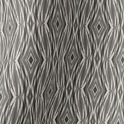 Image detail of a silk scarf featuring a linocut pattern in beige, gray, and black.