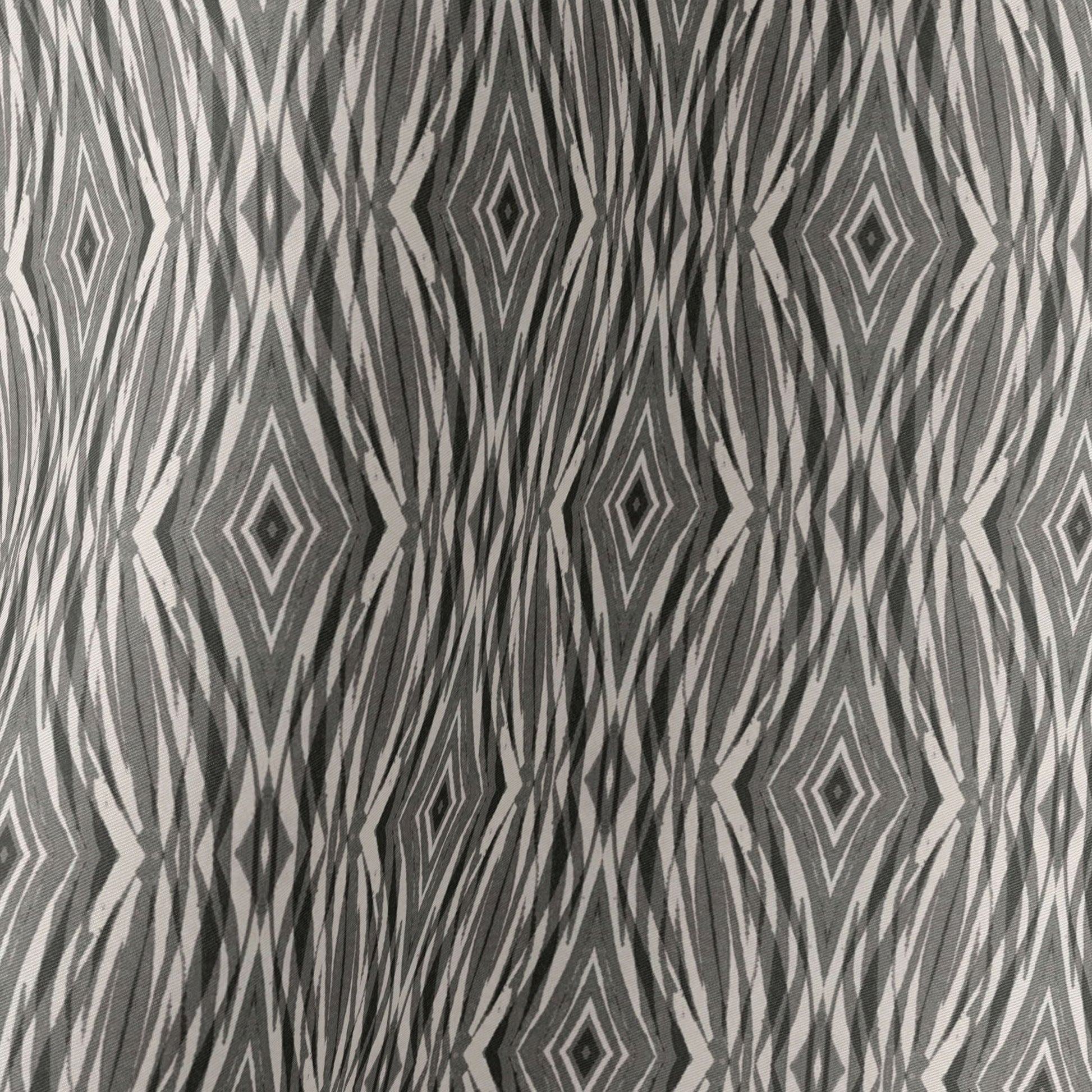 Detail of a linocut pattern in beige, gray, and black.