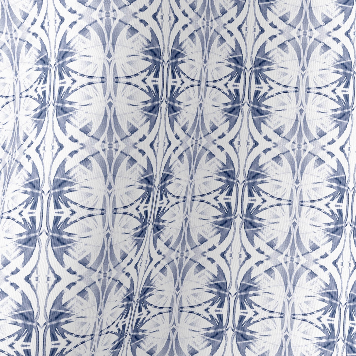 Detail of silk scarf featuring a hand-painted blue and white pattern.