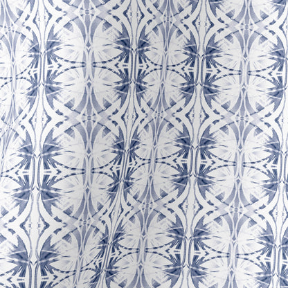 Detail of silk scarf featuring a hand-painted blue and white pattern.