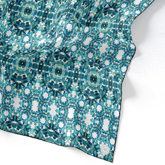 36x36 inch silk habotai scarf featuring a hand-painted pattern in teal, blue, and green tones.