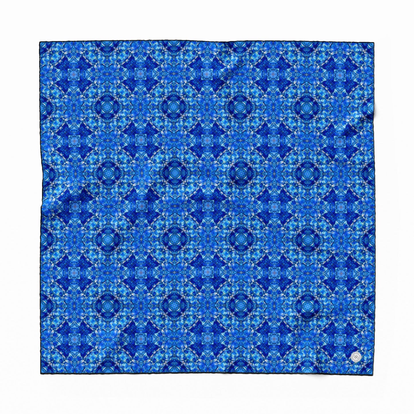 Silk scarf featuring a hand-painted cobalt blue pattern.