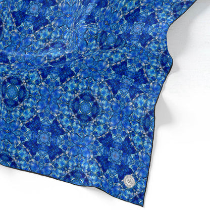 Silk scarf featuring a hand-painted cobalt blue pattern.
