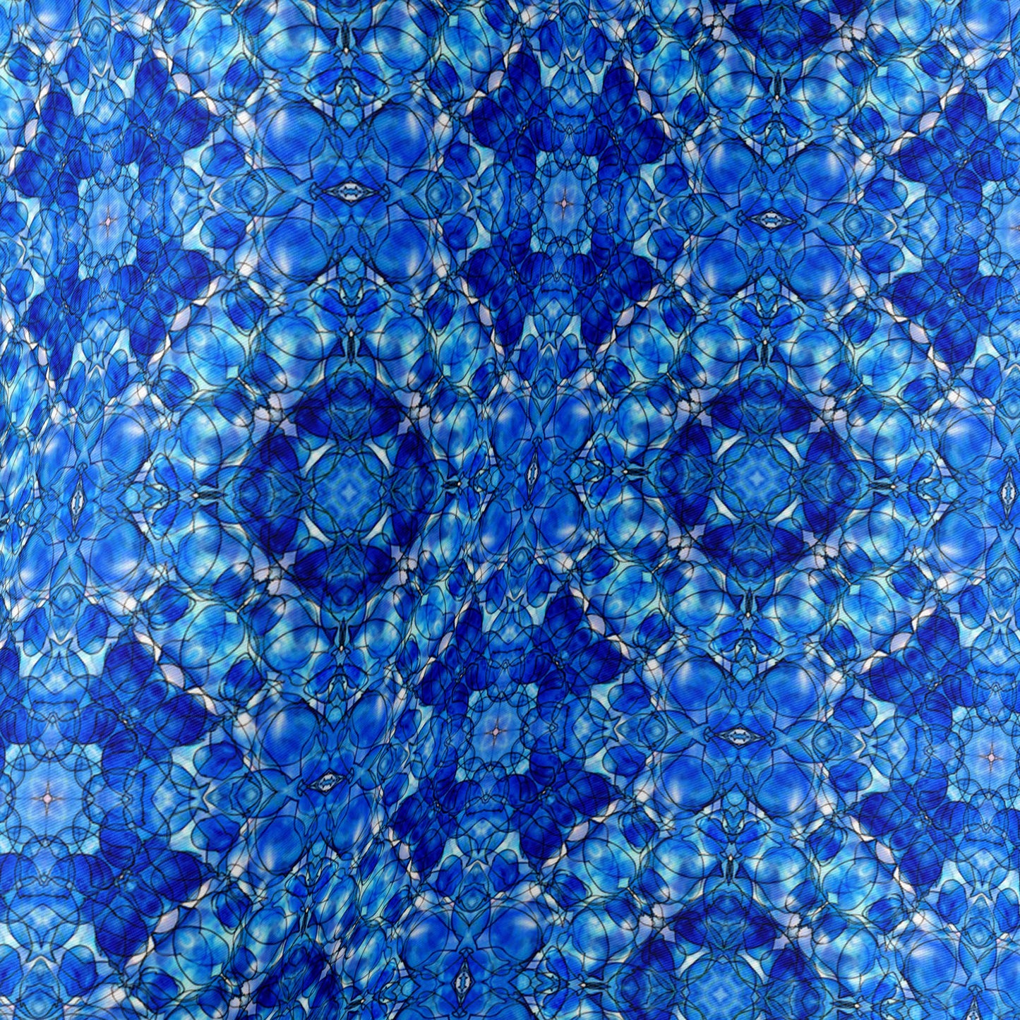 Detail of silk scarf featuring a hand-painted cobalt blue pattern.