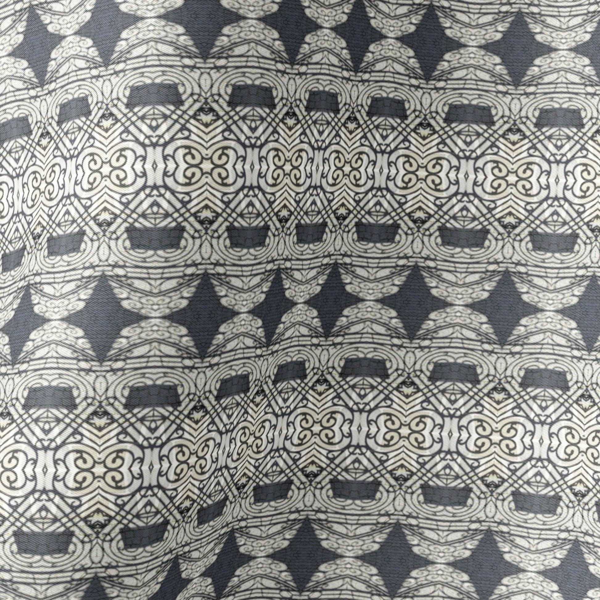 Detail of silk scarf featuring an abstract geometric pattern in gray and black.