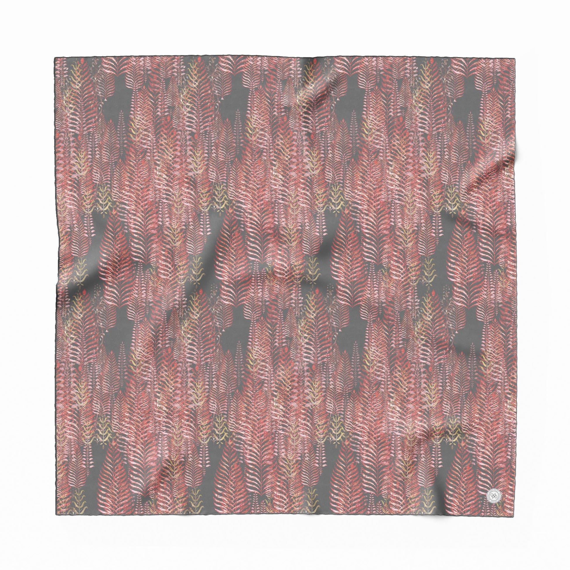 Silk scarf featuring a pink and gray woodblock pattern.