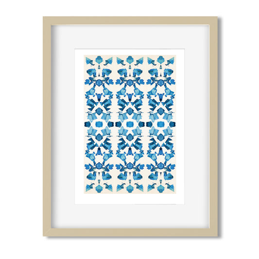 Framed print featuring abstract hand-painted pattern in blue tones. Blond wood frame.